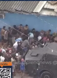 Multidão faminta briga por carga de carne em favela no Rio