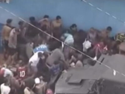 Multidão faminta briga por carga de carne em favela no Rio